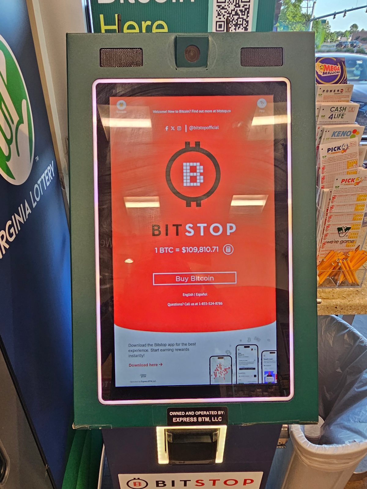 Bitstop Bitcoin ATM at a retail location showing Express BTM LLC sticker and Margo branding on the backing panel